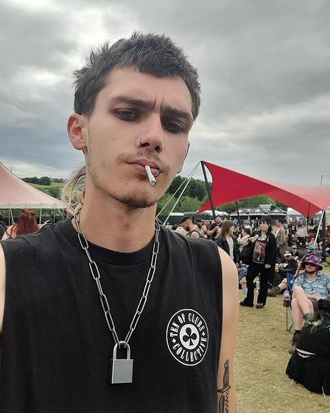 Man at music festival in TEN OF CLUBS Gunslinger Tee