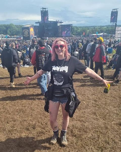 Woman at music festival in TEN OF CLUBS Head Cave Tee