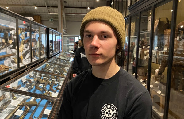 Young man in TEN OF CLUBS Gunslinger Tee