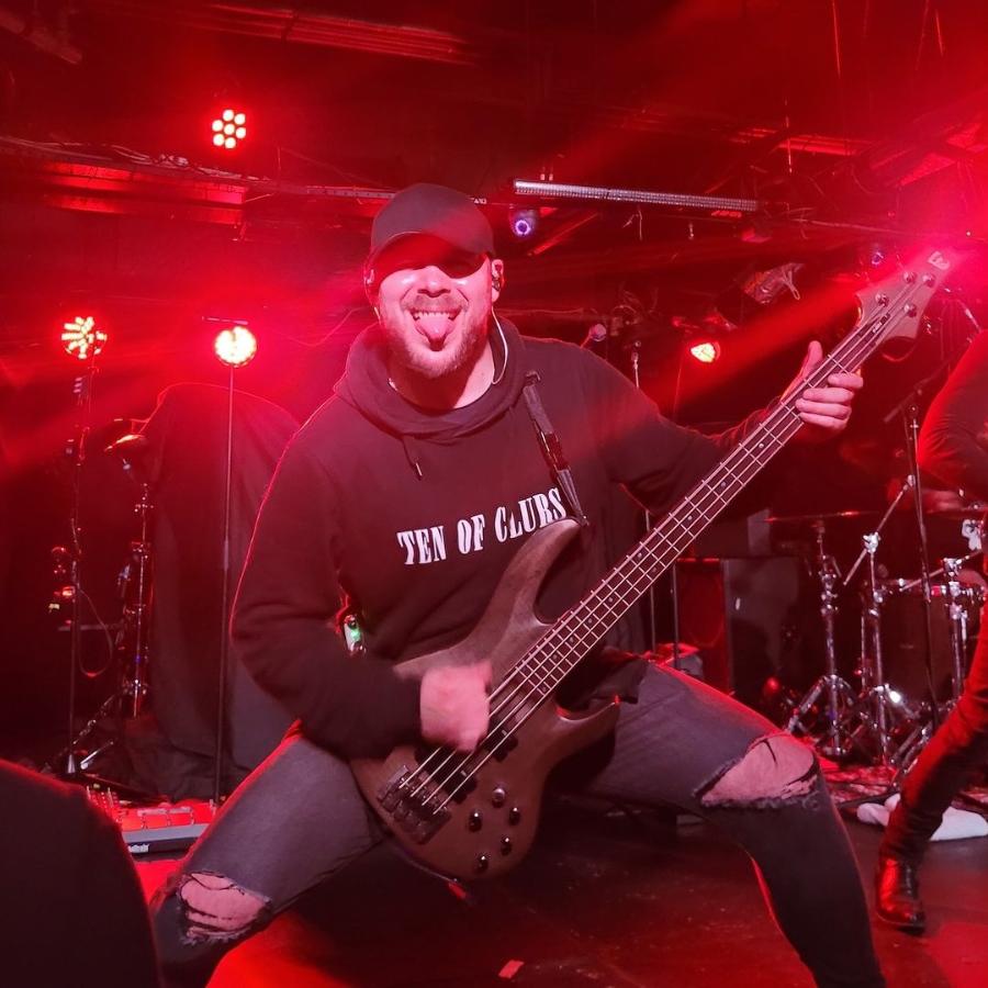 Defects bassist David Silver in a TEN OF CLUBS Wave Hoodie