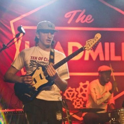 20MFG guitarist Harry Stephenson in a TEN OF CLUBS Jaws Tee