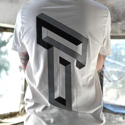Model wearing Blank Stare Tee white graphic t-shirt with optical illusion back print | alt streetwear by TEN OF CLUBS