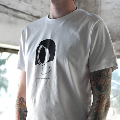 Model wearing Blank Stare Tee white graphic t-shirt with chest print | alt streetwear by TEN OF CLUBS