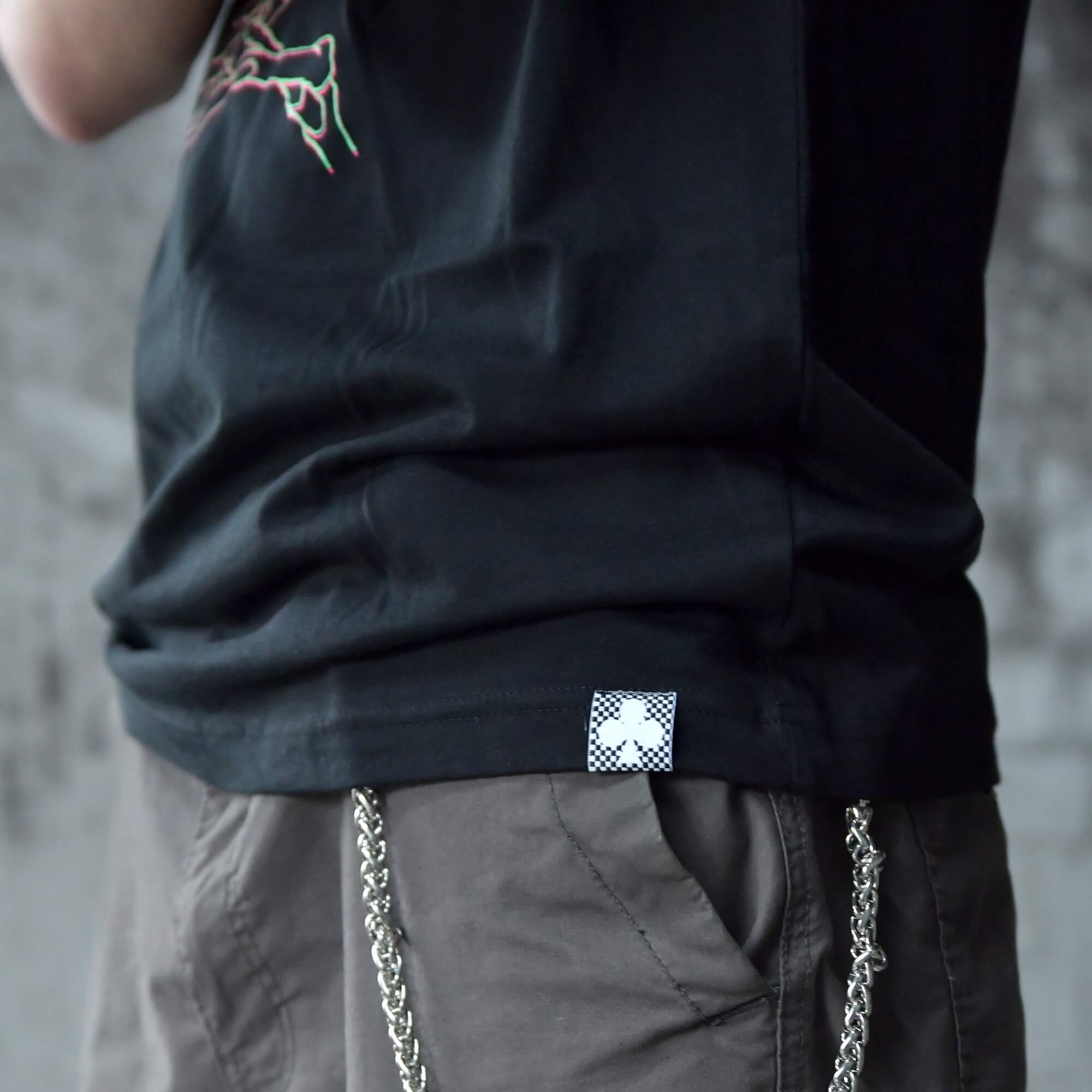 Neckbreaker Tee from TEN OF CLUBS black alt t-shirt hem tag