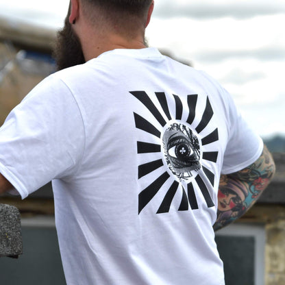 Model wearing Rise And Shine Tee white graphic t-shirt with Eye of Providence back print | alt streetwear by TEN OF CLUBS