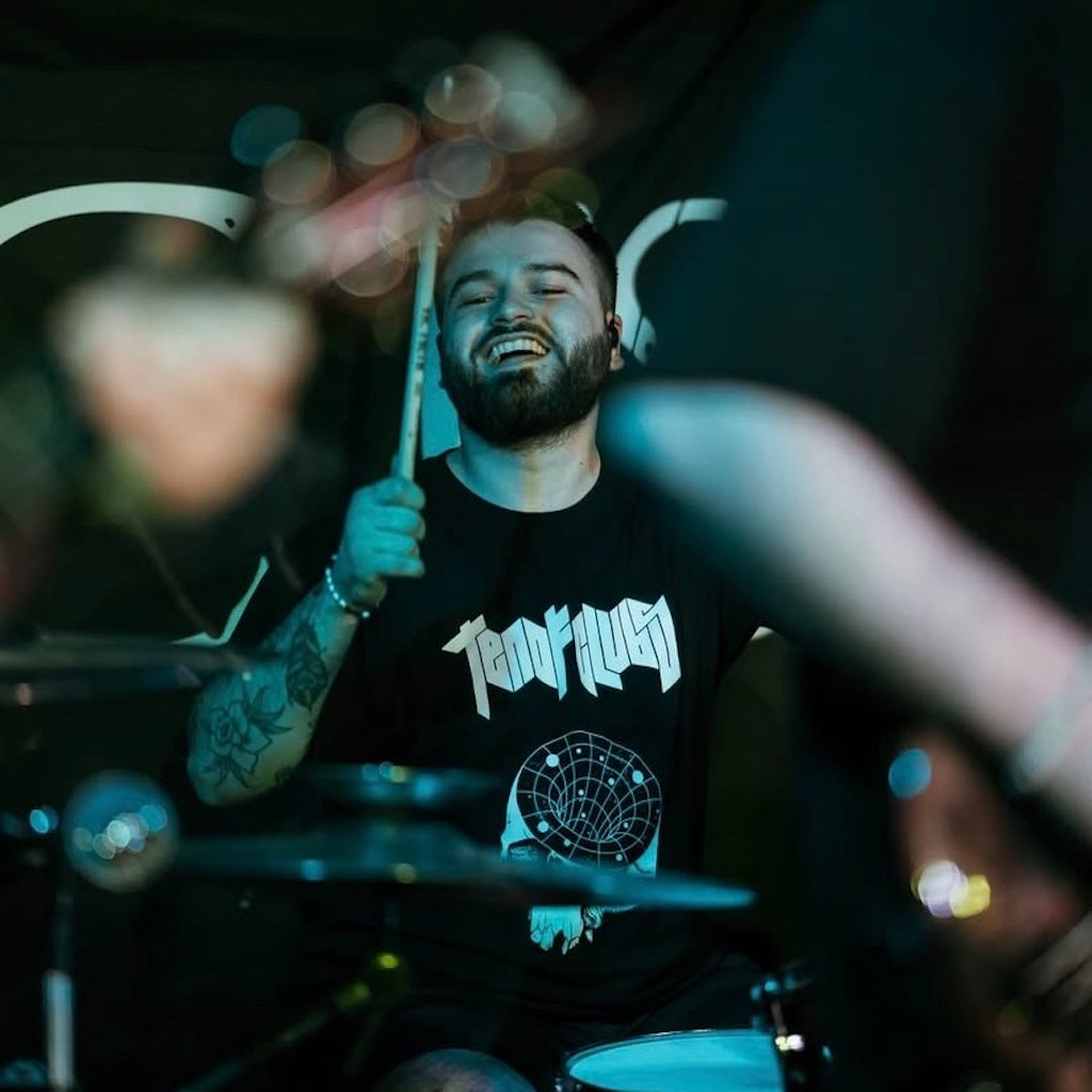 Head Cave Tee modelled by metal drummer Harry Jennings