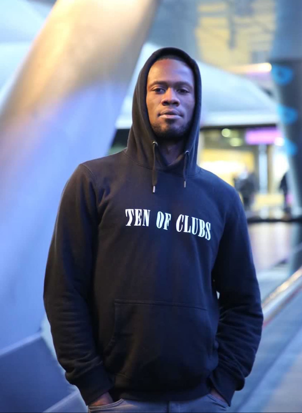 Musician Leon DC in black Ten of Clubs Wave Hoodie