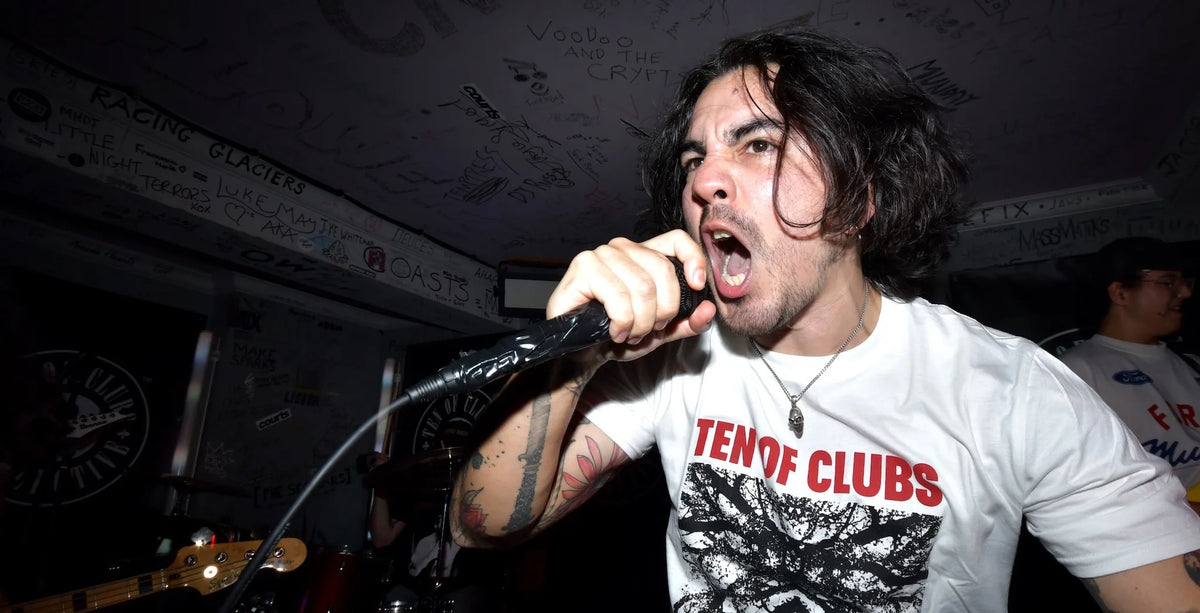 Chaos Reigns frontman Jason Heightman performing at TOCstock The Revenge, wearing a TEN OF CLUBS Jaws Tee and screaming into a microphone