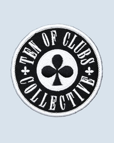 Round black TEN OF CLUBS Collective Patch with white embroidered lettering and border surrounding a central club symbol.