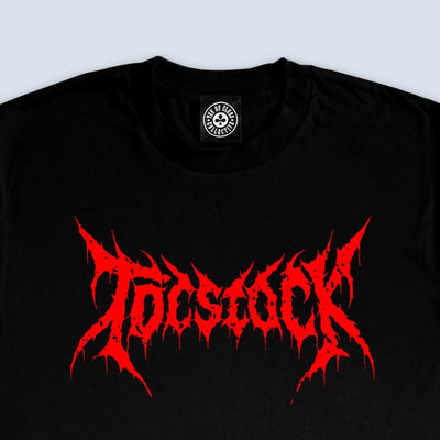 TOCstock The Revenge short-sleeve tee in black, flat lay showing the TEN OF CLUBS TOCstock logo printed on the chest against a clean white studio background.