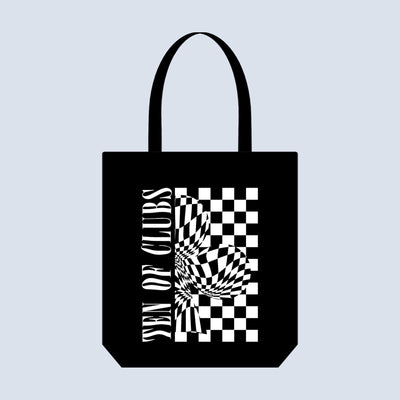 TEN OF CLUBS Wave Tote Bag in black with graphic artwork on the front, photographed flat lay against a clean white studio background.